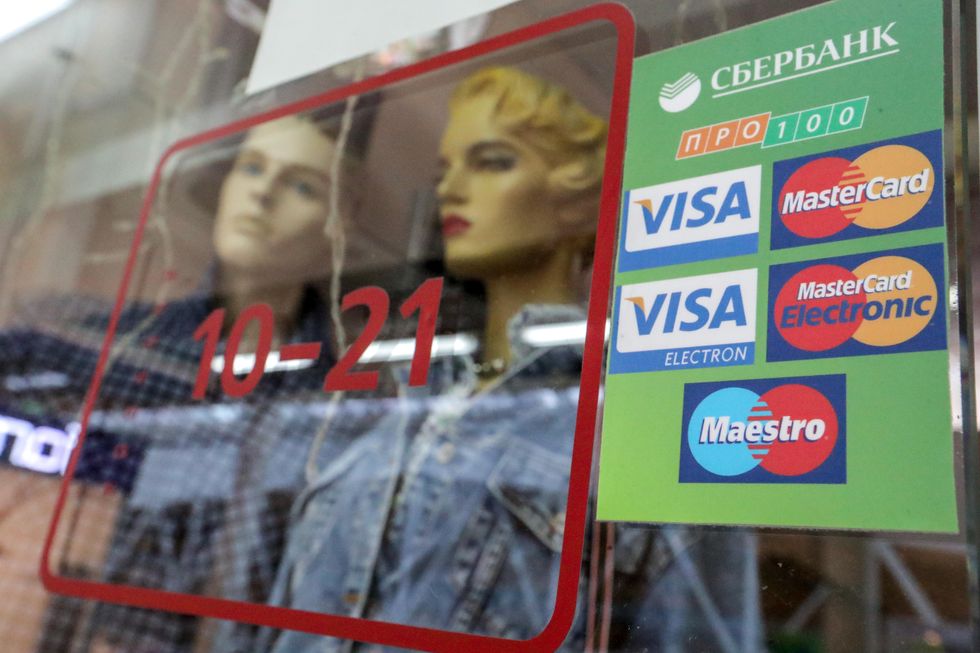 Photo of credit card logos in the window of a shop in St. Petersburg.
