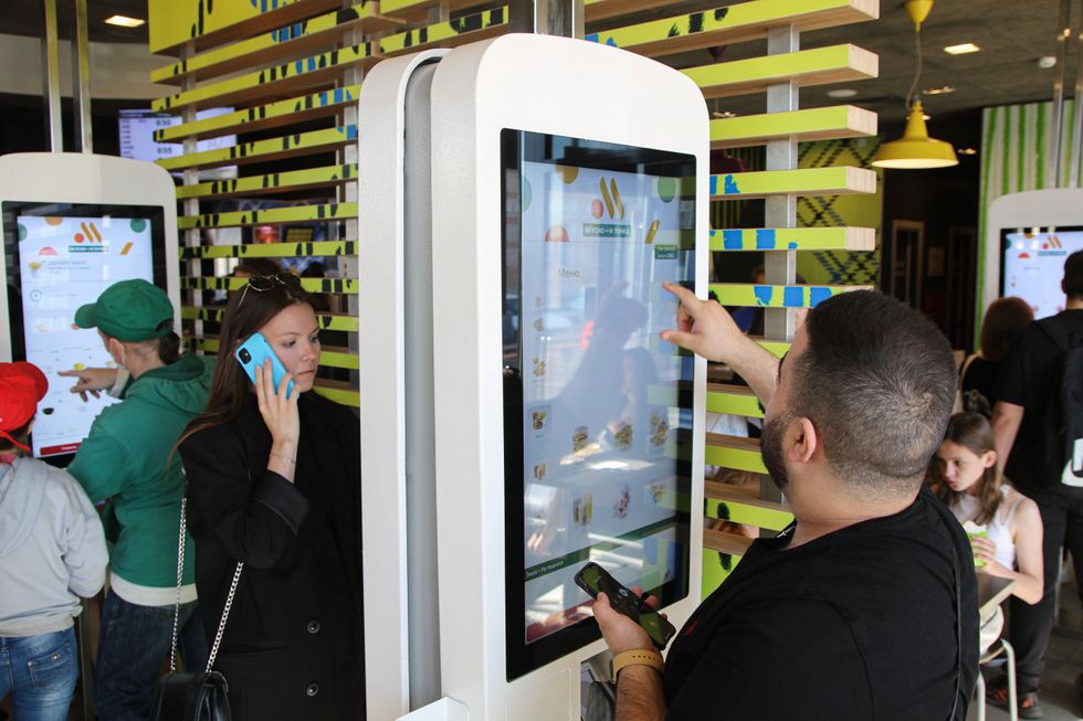 Photo of customers make their own orders at a fast-food restaurant in Moscow