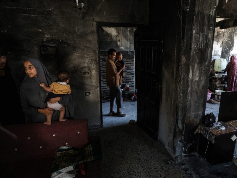photo of different people in different rooms of a house