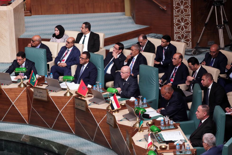 photo of diplomats sitting around a table