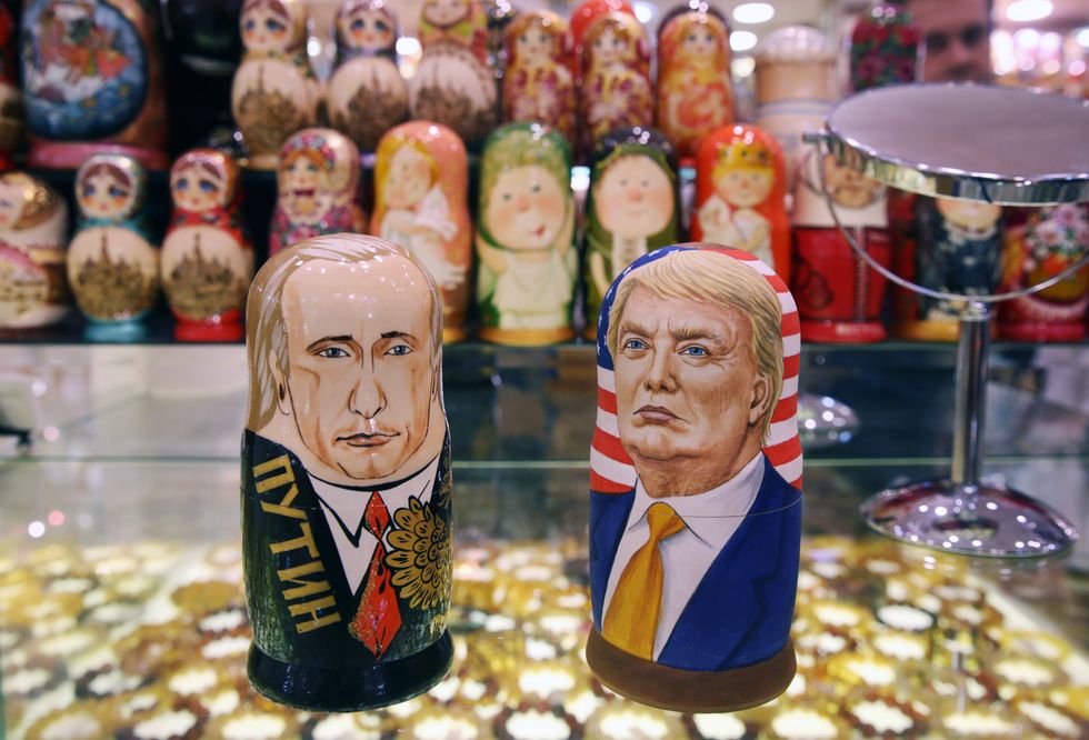 photo of dolls in the likeness of putin and trump