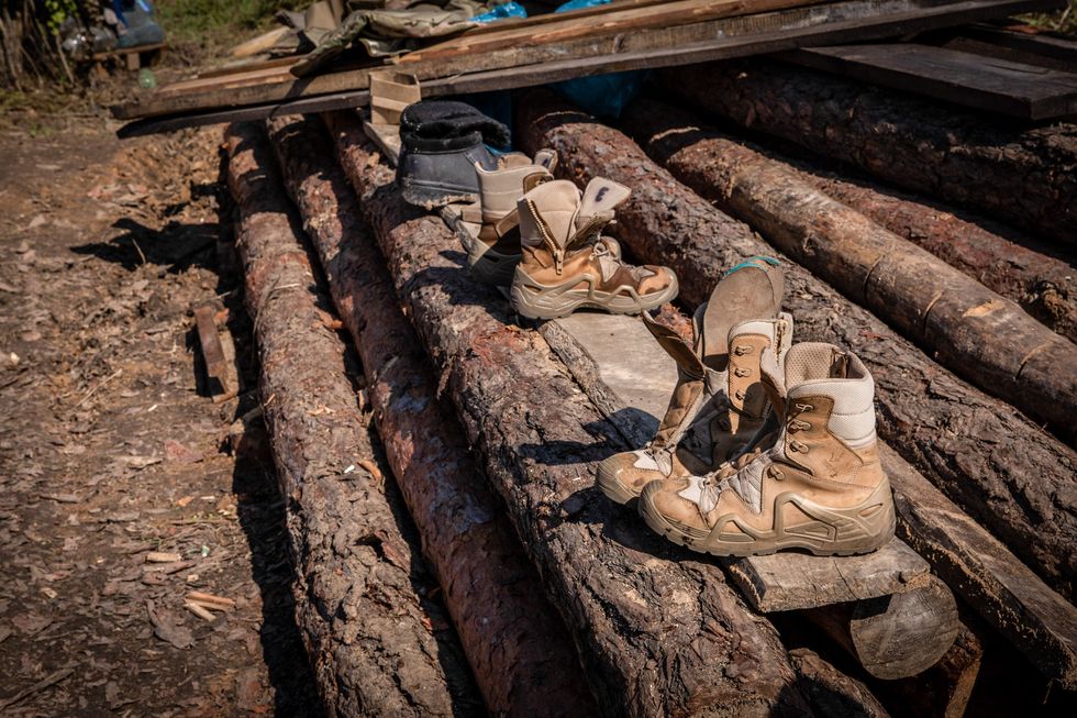 Photo of drying shoes of soldiers near the trenches in Ukraine