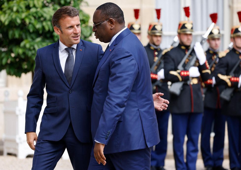 Photo of ​France's President Emmanuel Macron (L) welcoming his Senegalese counterpart Macky Sall (R) at the Elysee presidential palace before their bilateral meeting, in Paris on June 10, 2022.