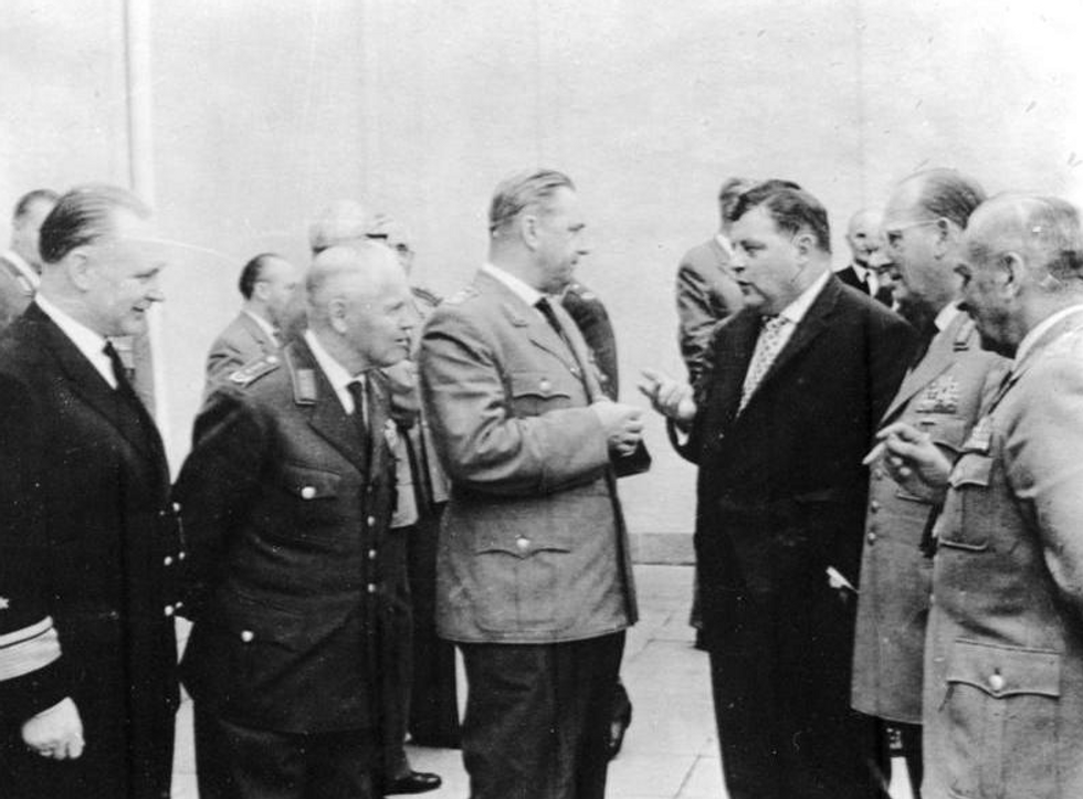 Photo of ​Germany's Defense Minister Franz-Josef Strauss (third from right) with German army generals in 1961, at the time of the Spiegel scandal.