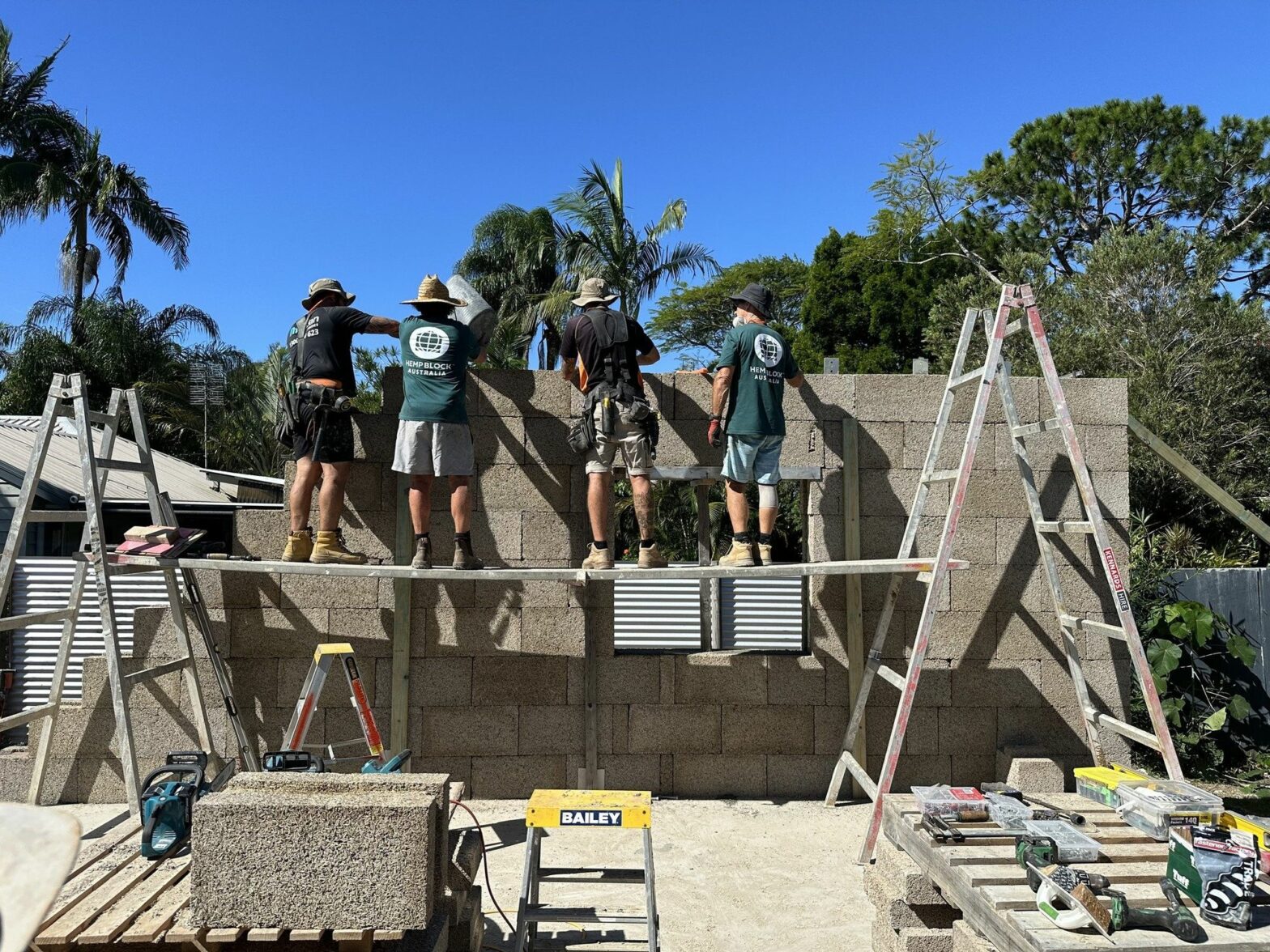 Photo of ​Hemp Block International teams building a wall using blocks of hempcrete