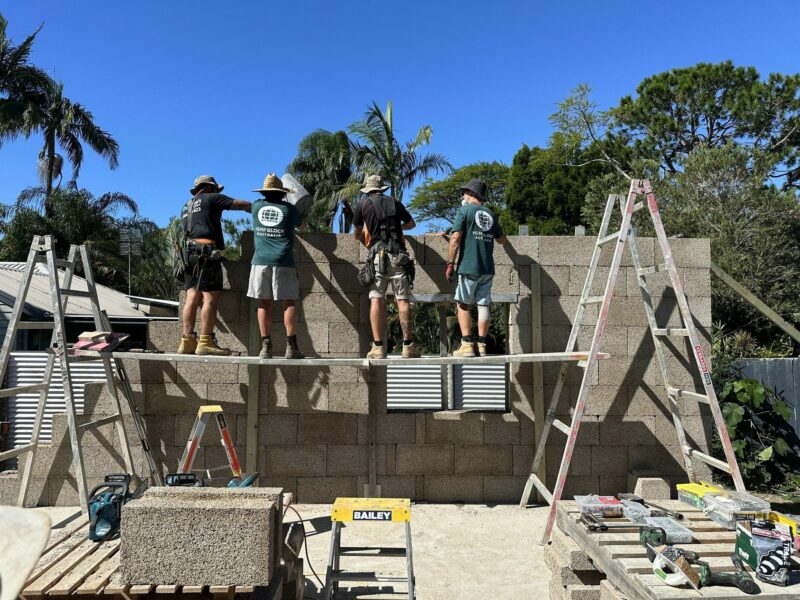 Photo of ​Hemp Block International teams building a wall using blocks of hempcrete