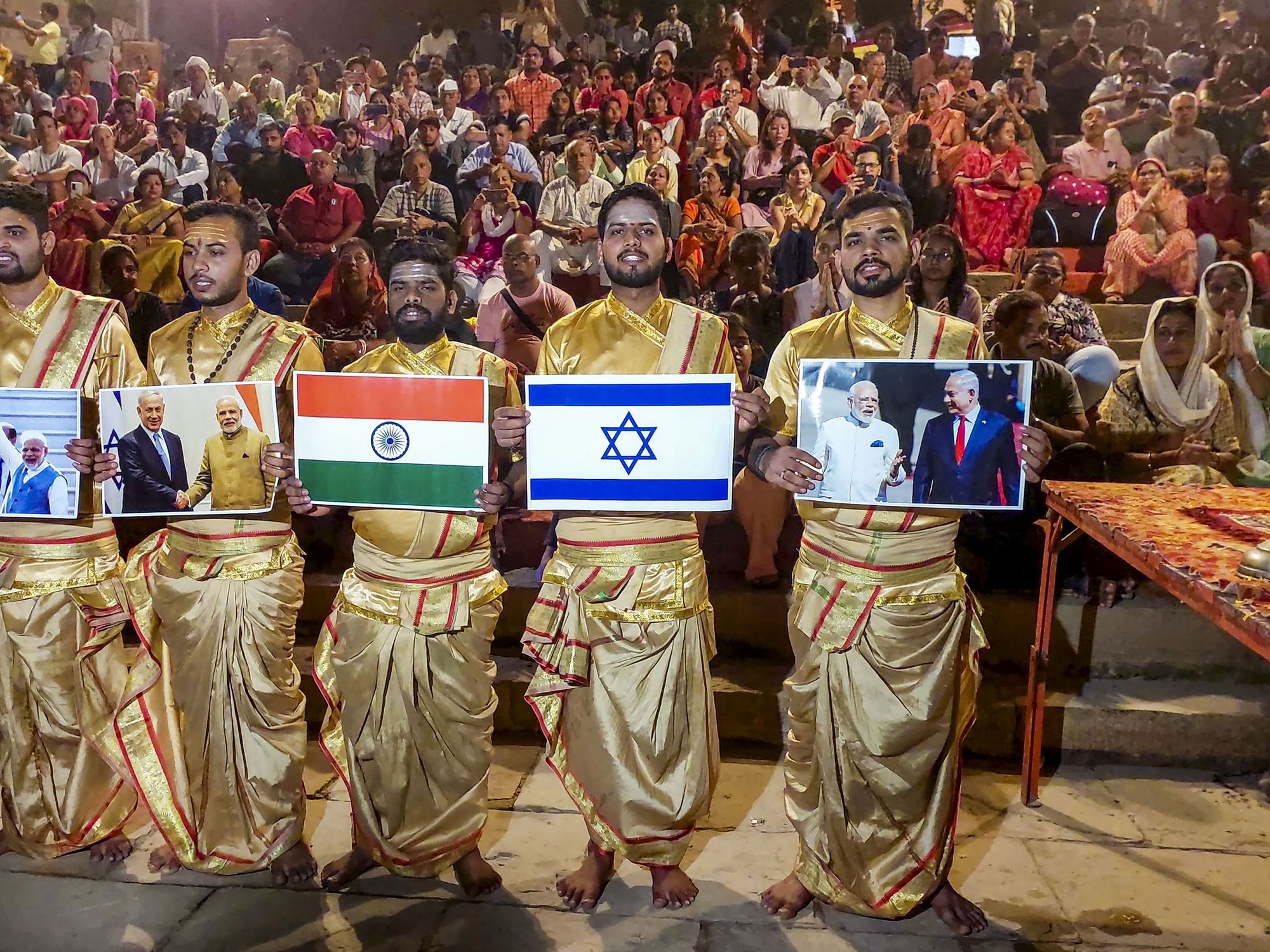 Photo of ​Indian seers at Varanasi’s Ganga Aarti showing support for Israel.
