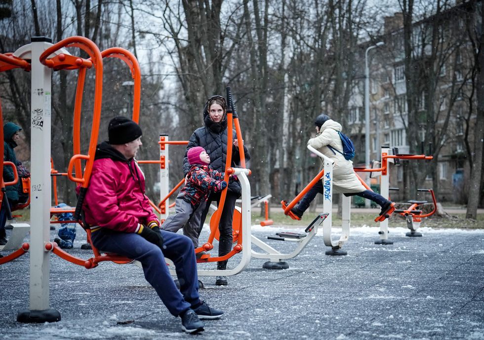Photo of ​Kyiv residents playing with fitness equipment on a square on Feb. 22