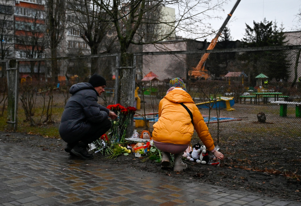 Photo of ​people paying tribute to the victims of the helicopter crash in Brovary