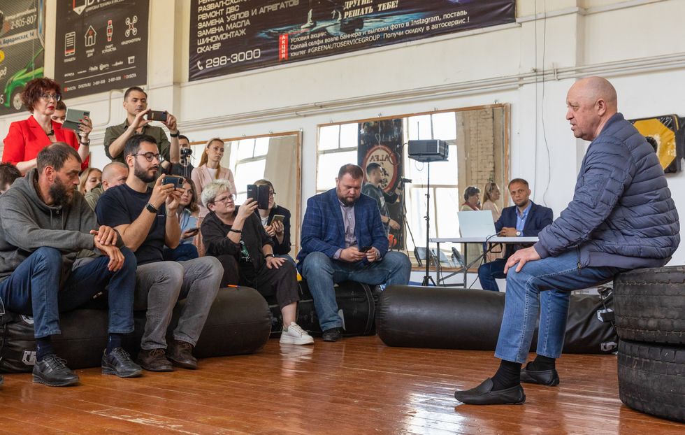 Photo of ​Prigozhin attending an presentation event for the Wagner Group's Second Front youth outreach project