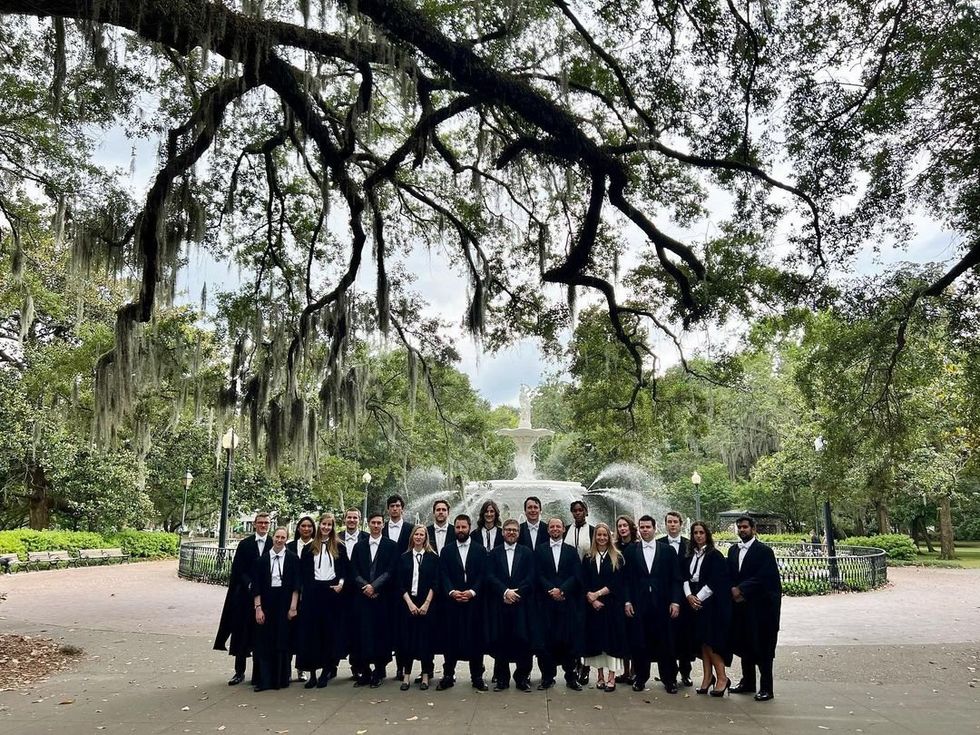 Photo of ​Ralston College graduates posing next to a fountain in Savannah