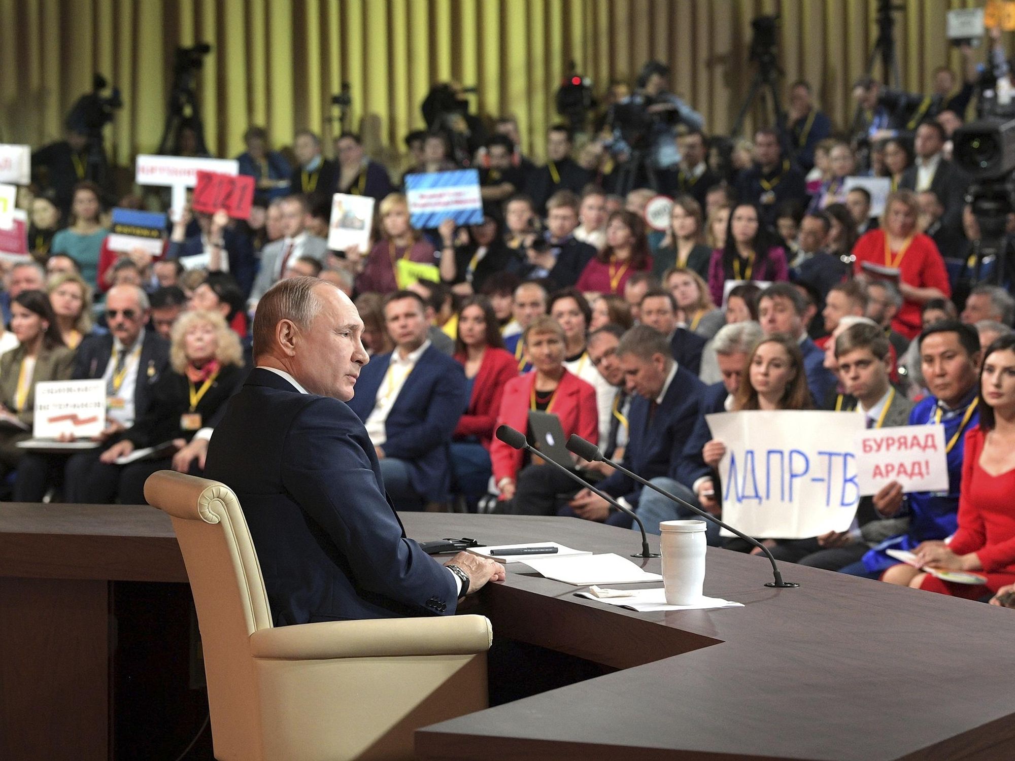 Photo of ​Russian President Vladimir Putin facing journalists during a press conference