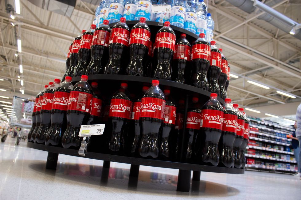 Photo of ​Stands with a Belarusian substitute drink for Coca-Cola are seen in a grocery store in Moscow. After Coca-Cola announced it was haling business in Russia, the new product hit the shelves in Moscow supermarkets.