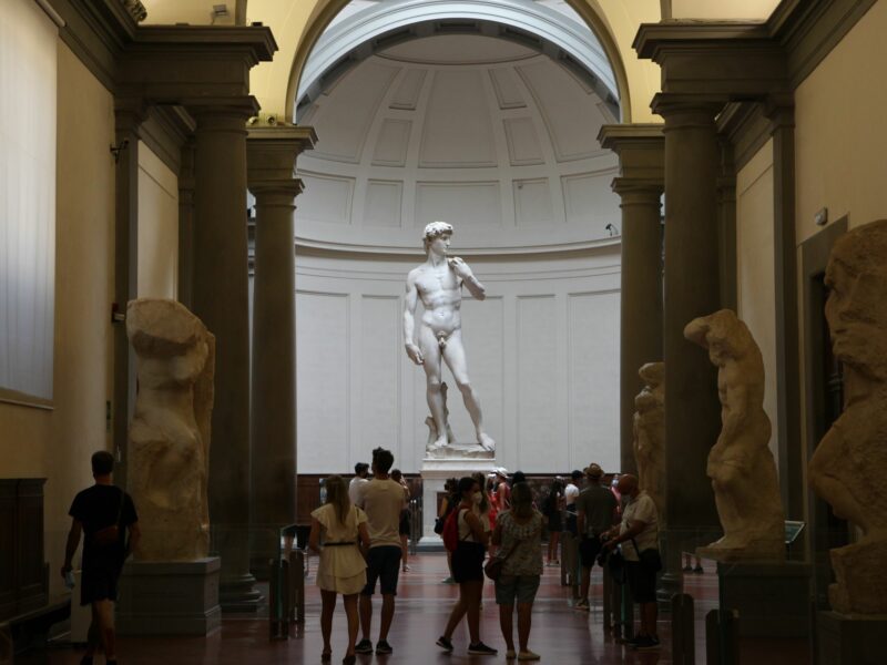 Photo of ​tourists visiting the Galleria dell'Accademia in Florence to see the David of Michelangelo.