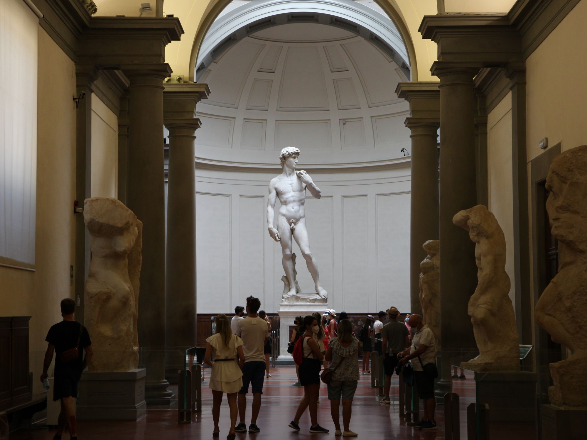 Photo of ​tourists visiting the Galleria dell'Accademia in Florence to see the David of Michelangelo.