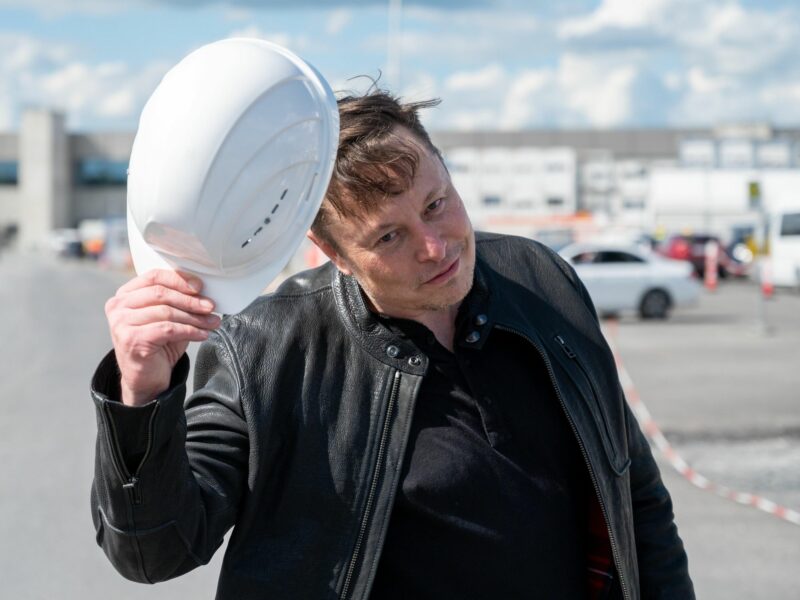 Photo of ​Twitter's new CEO Elon Musk tipping his hard hat as he visits a construction site in Germany