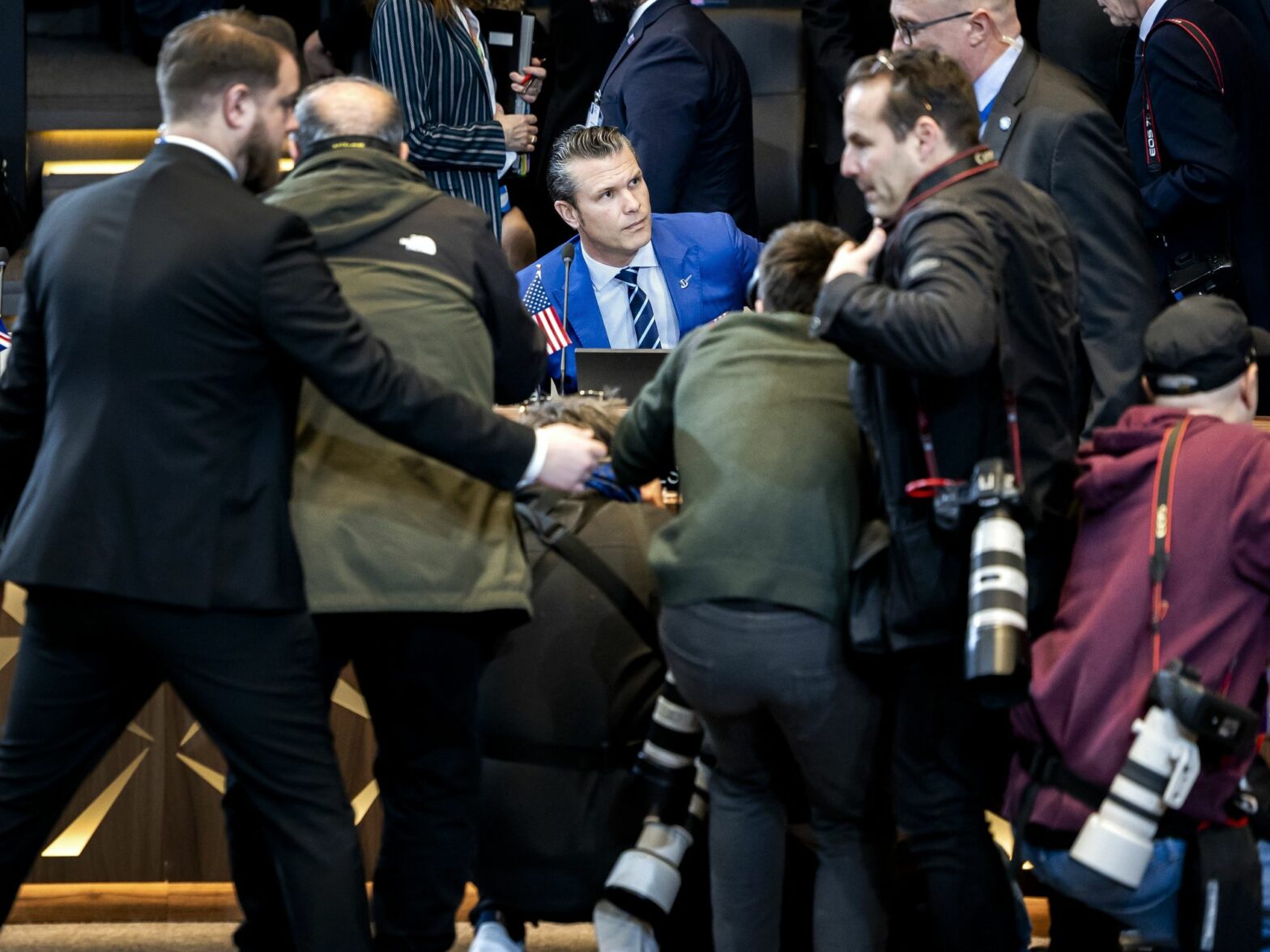 photo of ​U.S. Defense Secretary Pete Hegseth surrounded by photographers