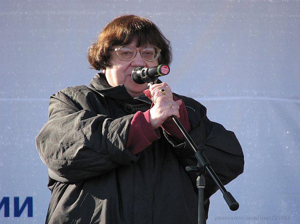 Photo of ​Valeriya Novodvorskaya speaking in a microphone at a rally in 2010