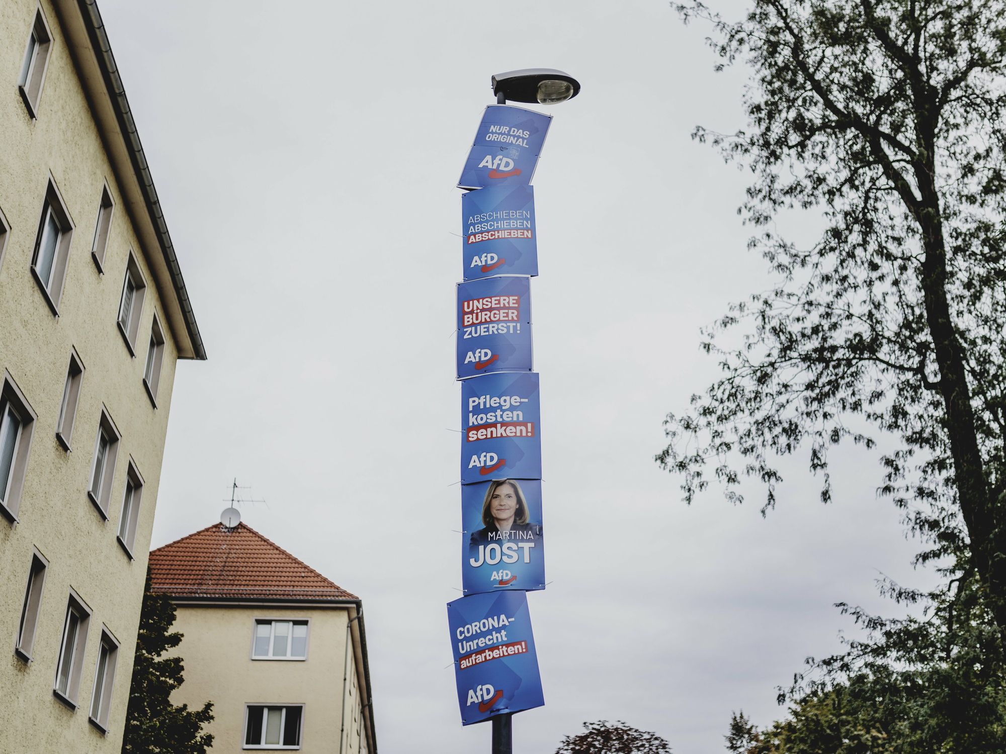 Photo of election posters of the AfD hanging on a lamppost in Germany