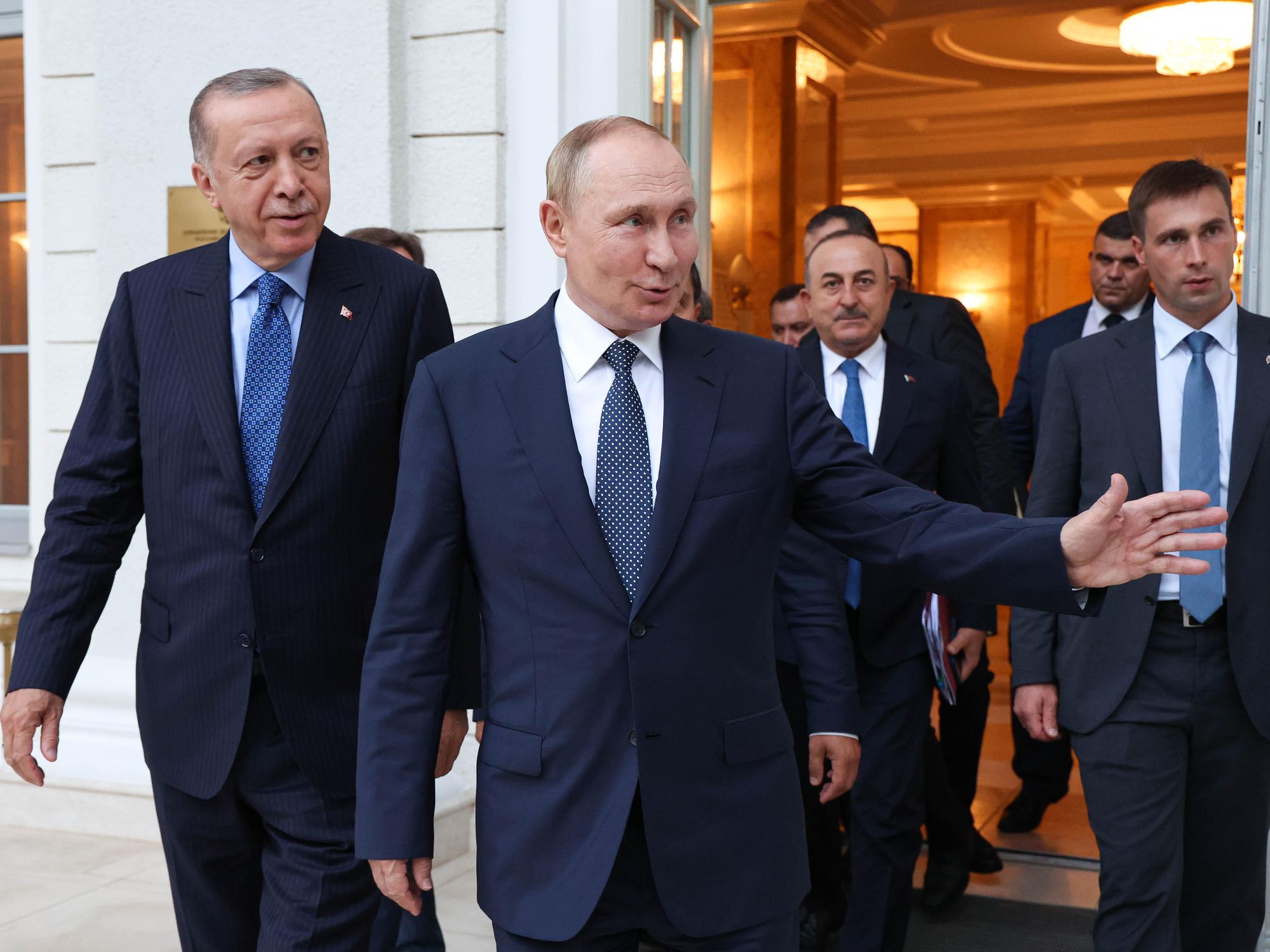 Photo of Erdogan and Putin walking out of a door