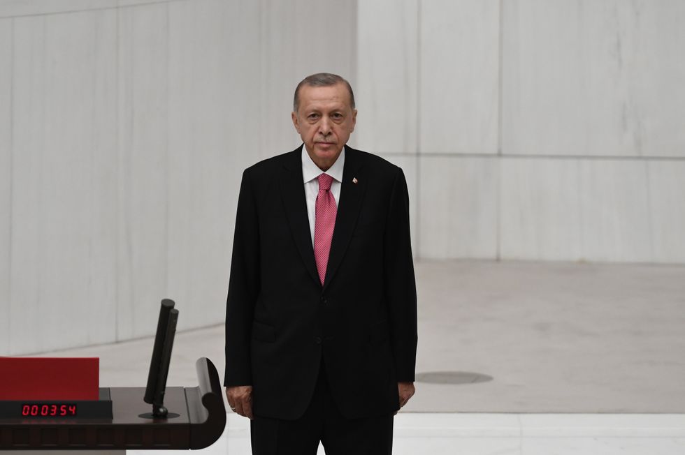 photo of erdogan standing on stage