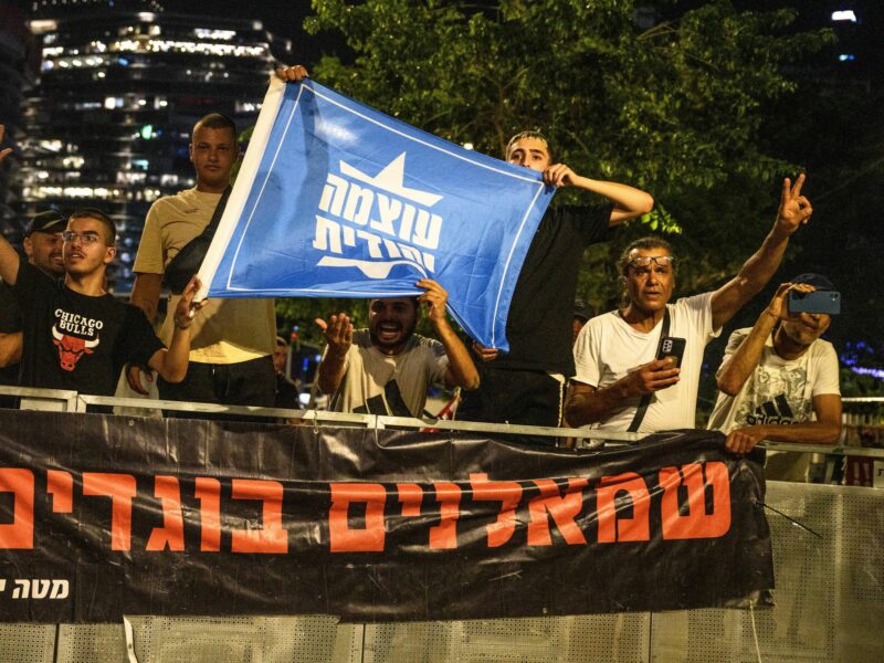 Photo of Extreme right-wing protestors holding a ''Jewish Power'' flag in Tel Aviv on June 15