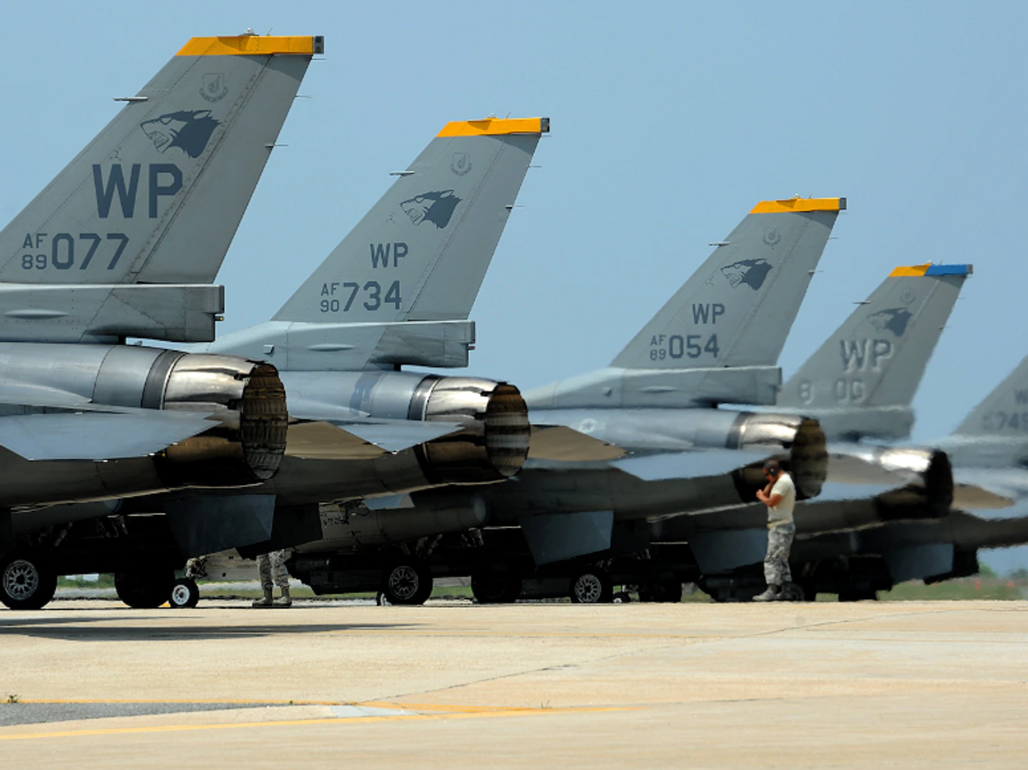 Photo of F-16 Fighting Falcons line up on the runway before taking off during Surge Week at Kunsan Air Base, Republic of Korea