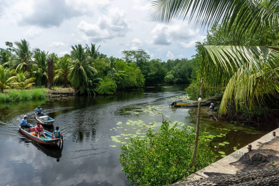 Photo of fishermen going out into the lagoon.