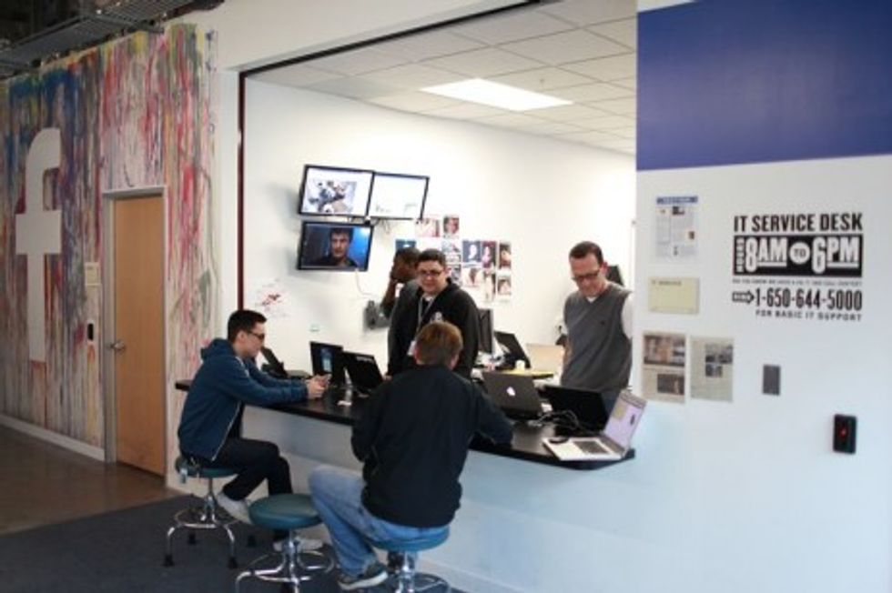 photo of four men at Facebook offices