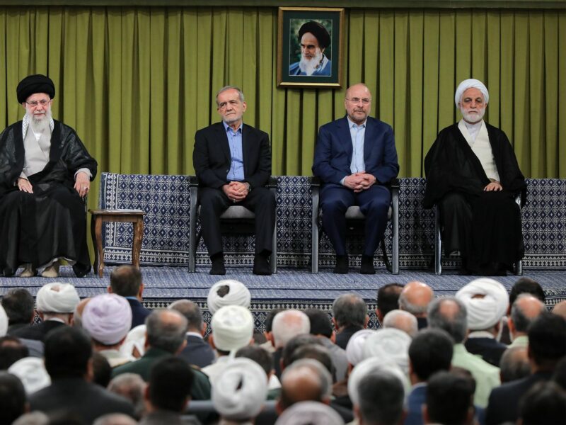 photo of four men on a stage