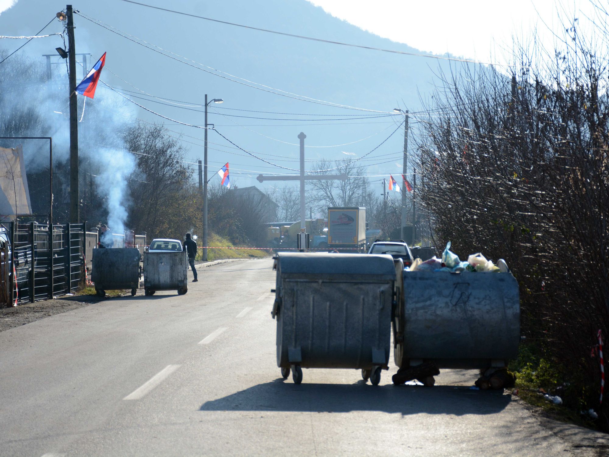 photo of garbage bins blocking the road