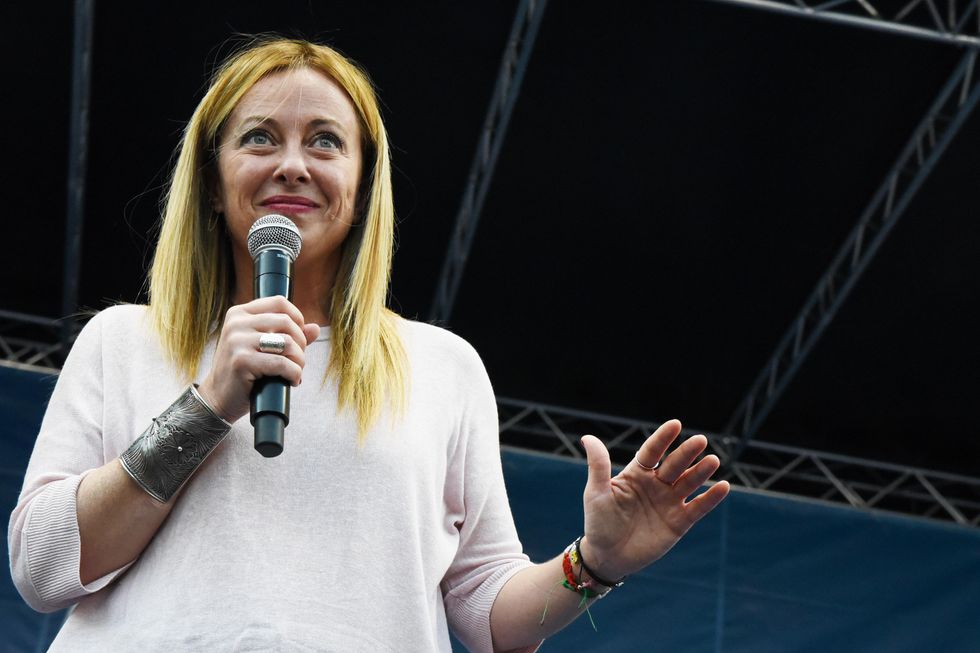 photo of Giorgia Meloni talking into a microphone
