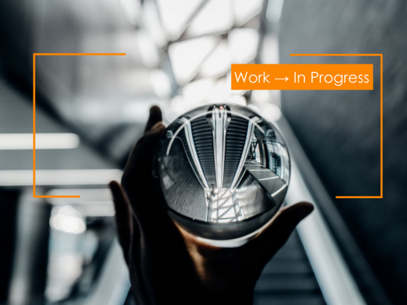 Photo of hands carrying a crystal ball in front of an escalator