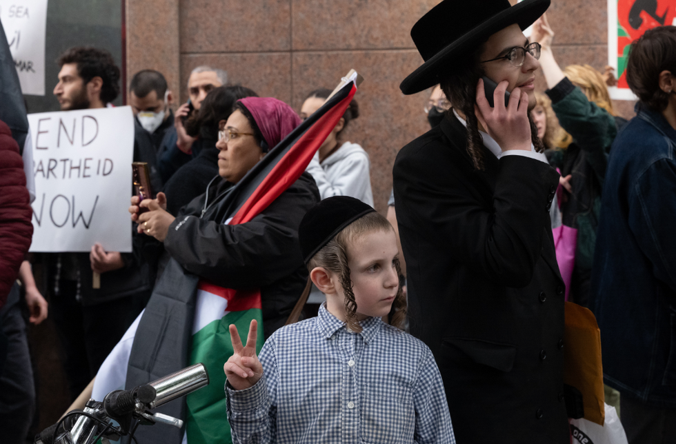 Photo of Hasidic Jews during a pro-Palestinian rally outside the Alamin Mosque and Almadinah School in New York on Oct. 7
