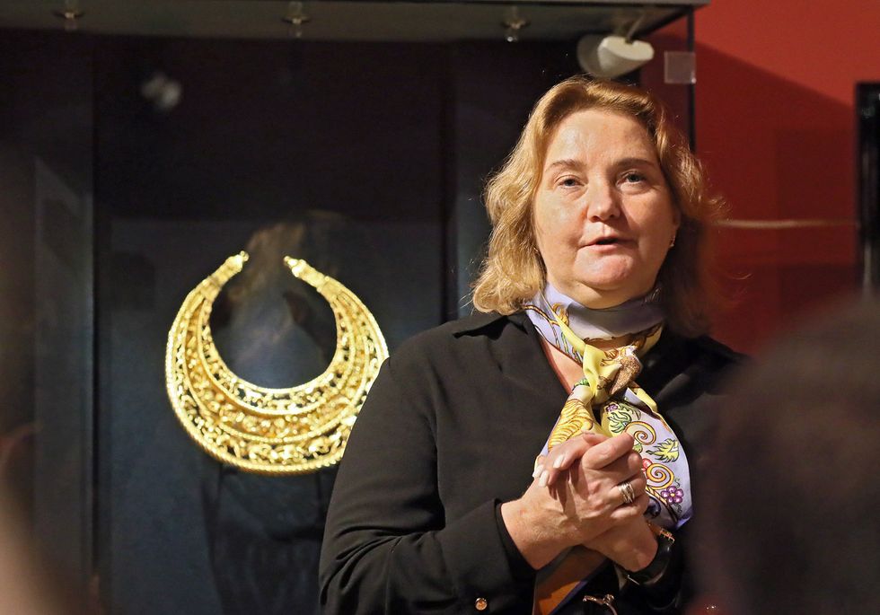 Photo of Head of the branch of the Treasury of the National Museum of History of Ukraine Nataliia Panchenko is seen during the presentation of selected artifacts from the collection ''Crimea: Gold and Secrets of the Black Sea'' returned to Ukraine after more than 10 years of storage abroad, presented in one of the halls of the Treasury of the National Museum of History of Ukraine on the premises of the Kyiv-Pechersk Lavra National Reserve, Kyiv