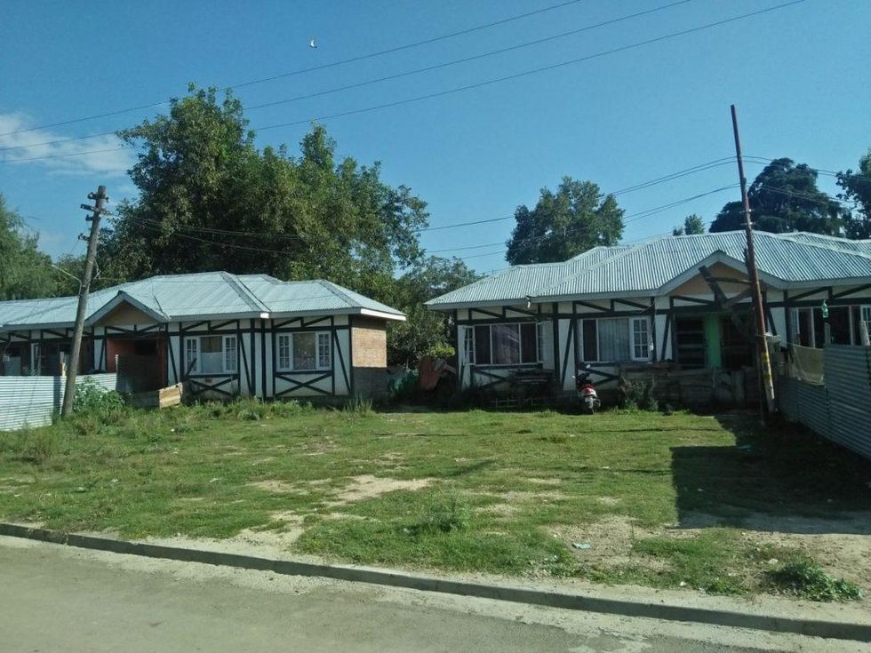 Photo of houses and trees on the colony