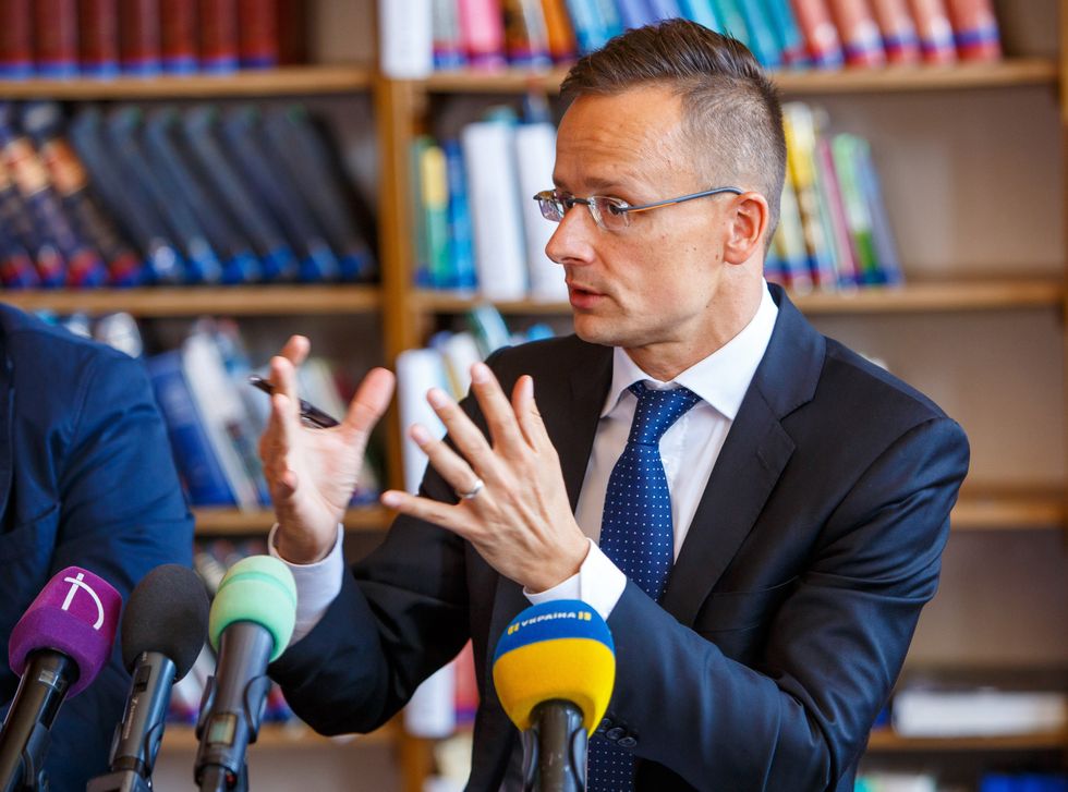 Photo of Hungarian Foreign Minister giving a news conference in Berehove