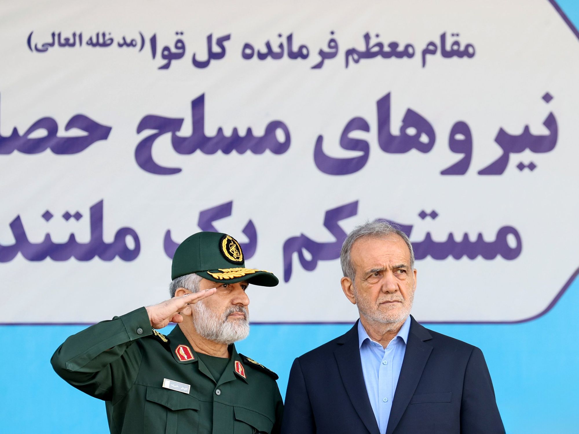 photo of Iranian President Masoud Pezeshkian (right) and commander of the Revolutionary Guard Corps Aerospace Force Amir Ali Hajizadeh