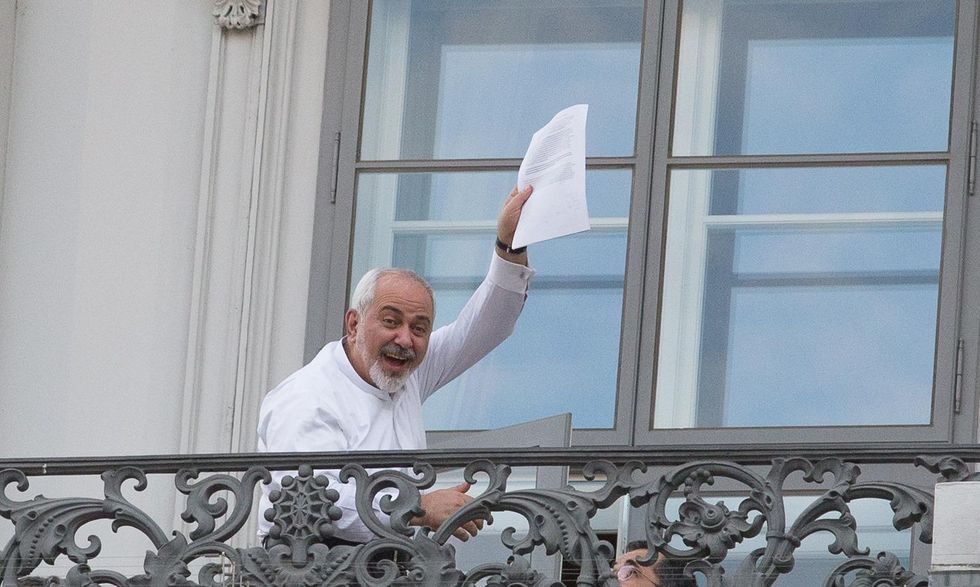 Photo of Iran's Minister for Foreign Affairs Mohammad Javad Zarif holding a draft of the nuclear agreement in Vienna Javad Zarif