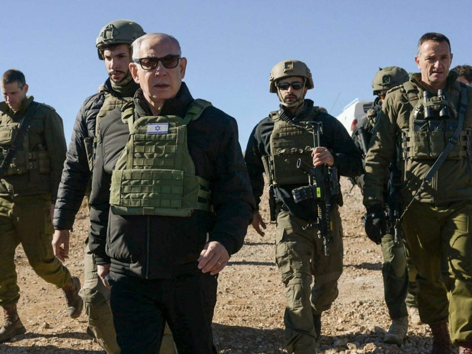 Photo of Israeli Prime Minister Benjamin Netanyahu in military gear walking alongside IDF troops on Dec. 17.