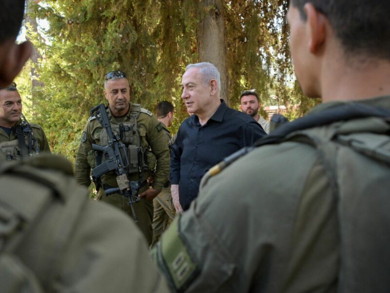 Photo of Israeli Prime Minister Benjamin Netanyahu meeting with IDF troops while touring Israel's northern border with Lebanon in late August.