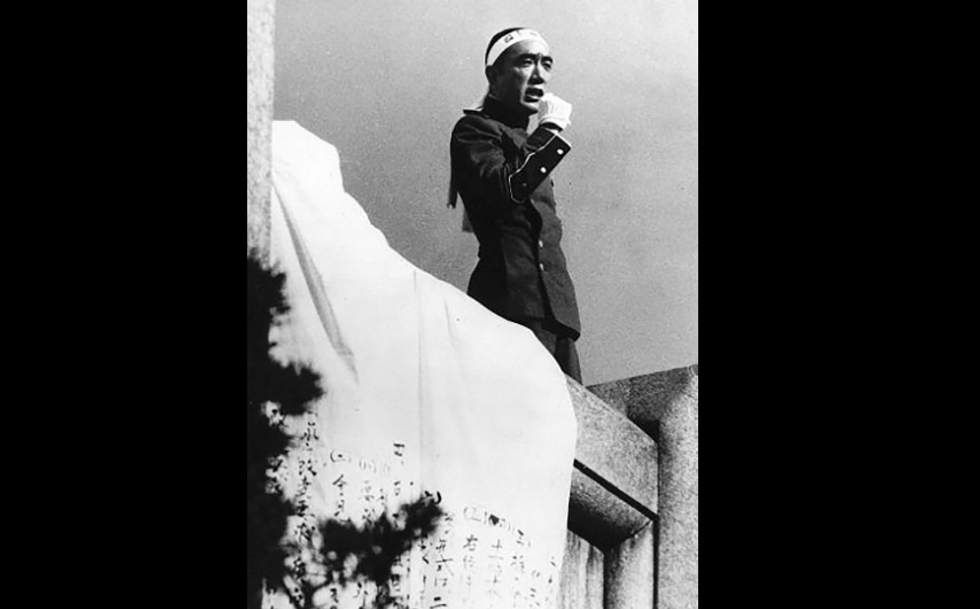 Photo of Japanese writer ​Mishima Yukio delivering a speech in 1970