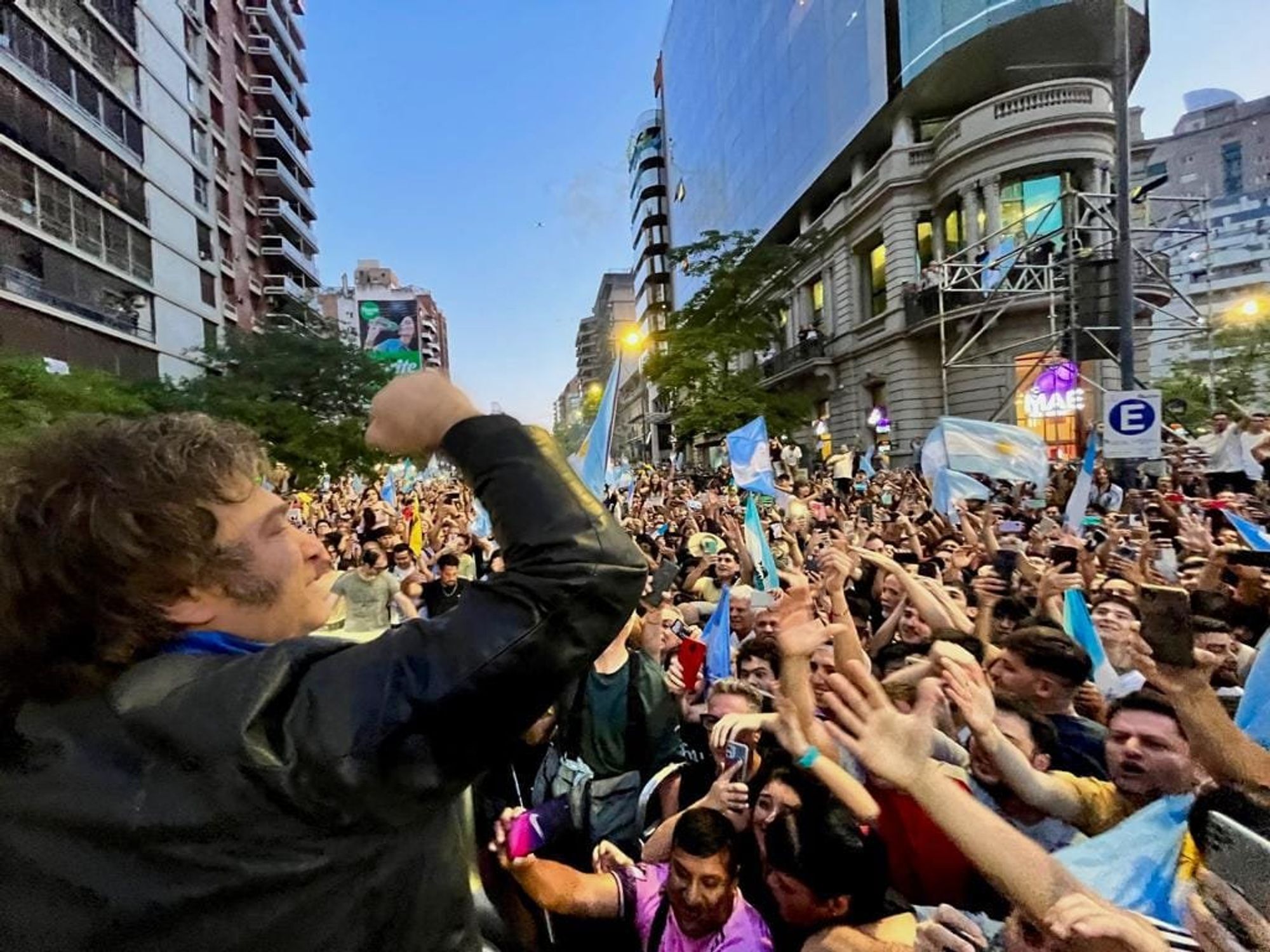 Photo of Javier Milei standing in front of his supporters