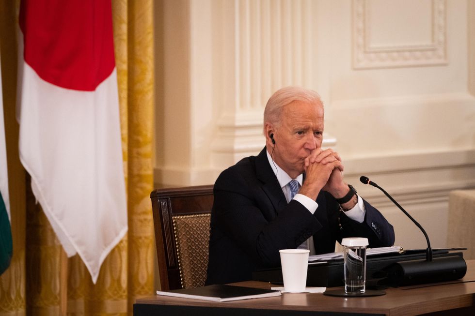 photo of joe biden listening at a summit