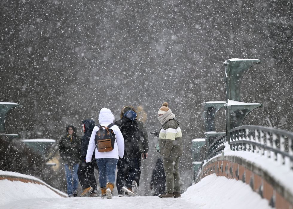 photo of kids walking in snow