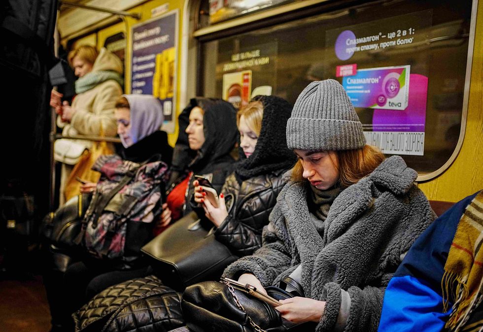 Photo of locals sitting in the Kyiv metro during an air raid alert on Feb. 22