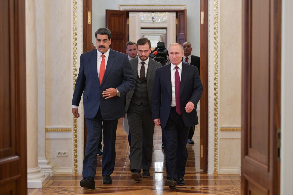photo of maduro and putin walking