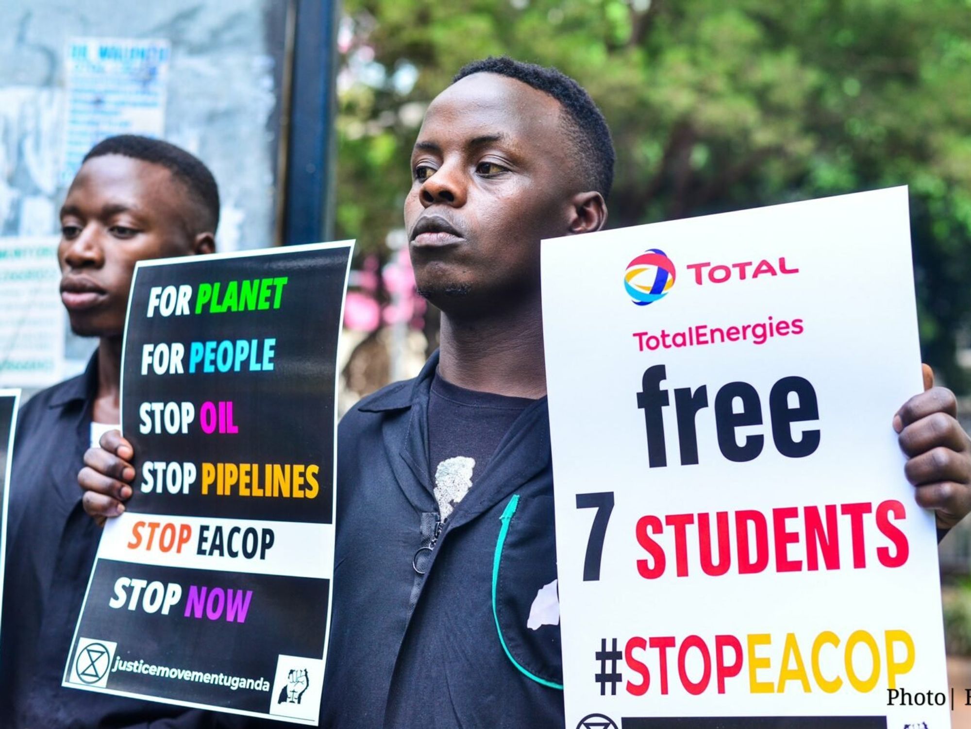 Photo of man holding signs #StopEACOP