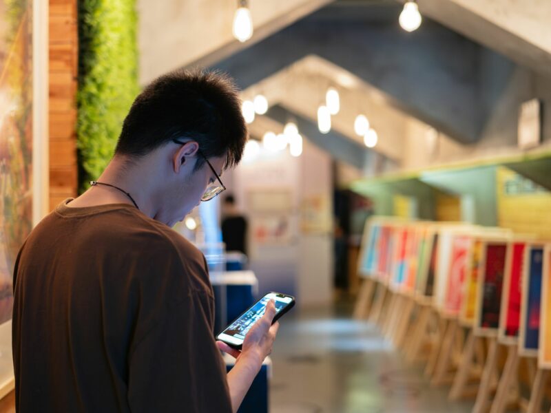 Photo of man looking at his phone