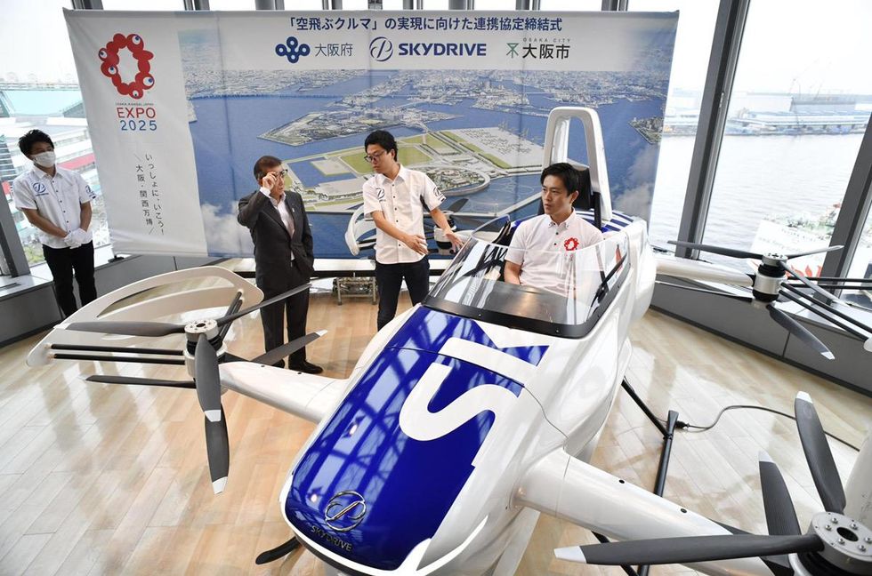 Photo of man testing out Suzuki Motor flying car